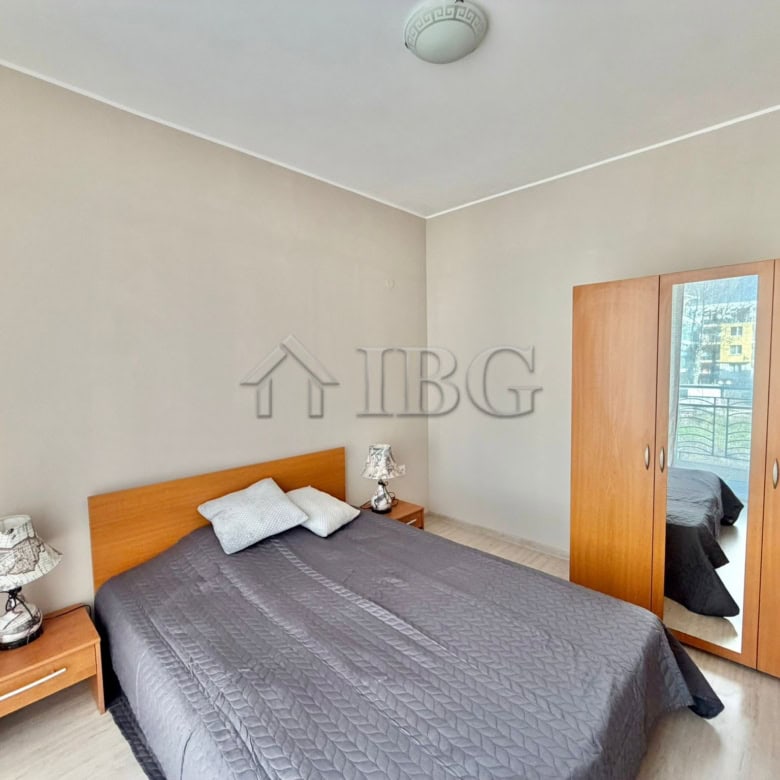 Apartment with bedroom, wardrobe, and balcony view in Sunny Beach.