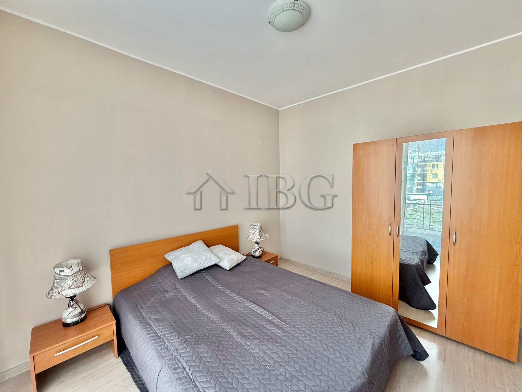 Apartment with bedroom, wardrobe, and balcony view in Sunny Beach.