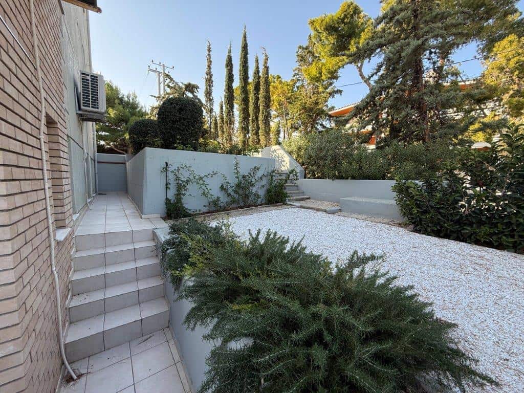 Luxury 3-bedroom home for sale in Neos Voutzas, Attica, Greece, featuring a landscaped garden and mo.