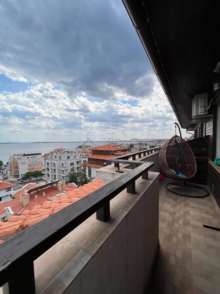 Balcony with stunning sea views in Sveti Vlas, Bulgaria, featuring modern outdoor furniture and a sc.