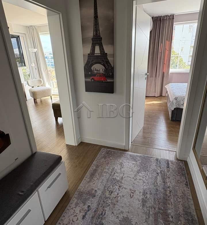 Bright entrance hall with Paris-themed artwork and access to bedrooms.