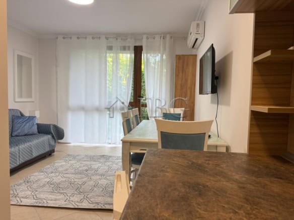 Bright studio apartment with balcony overlooking lush green yard in Cascadas Complex, Sunny Beach.