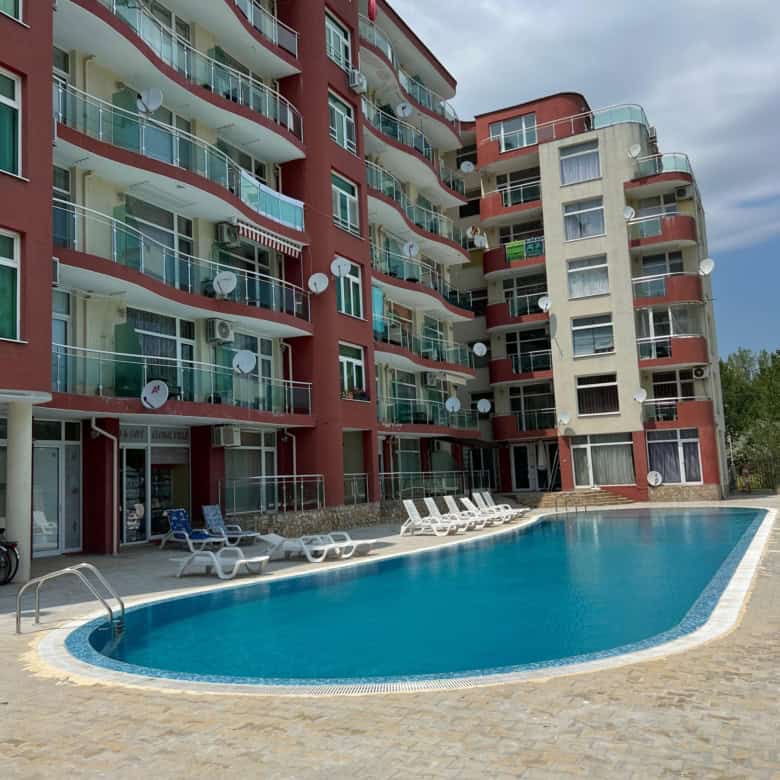 Apartment building with pool and balconies in Sunny Beach, Bulgaria.