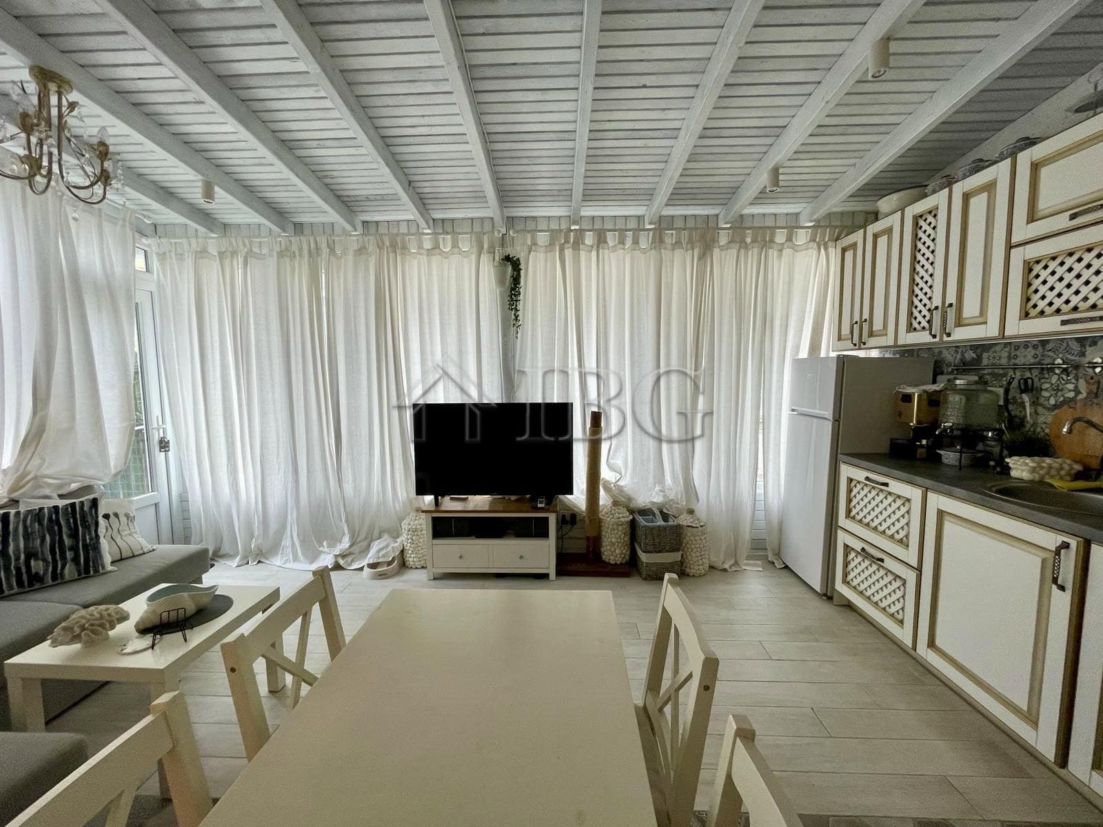 Bright living room with large windows and white curtains in Sun Gate, Sunny Beach.