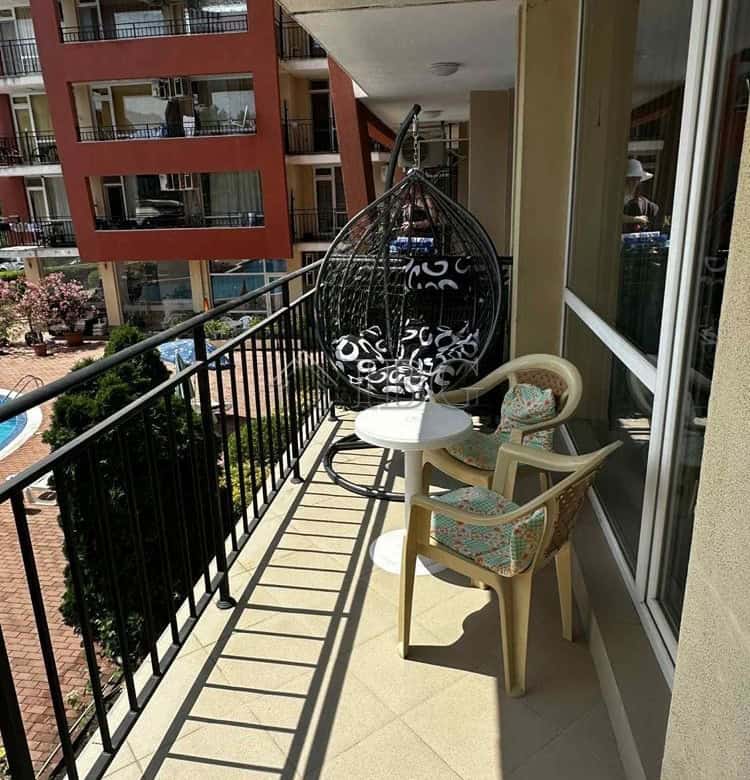 Balcony view of a modern apartment with pool scenery in Sunny Beach, Bulgaria.