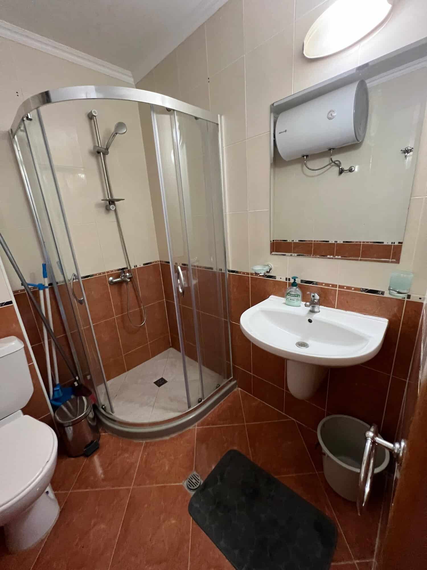 Bathroom with shower cabin, sink, and toilet in Sveti Vlas property.