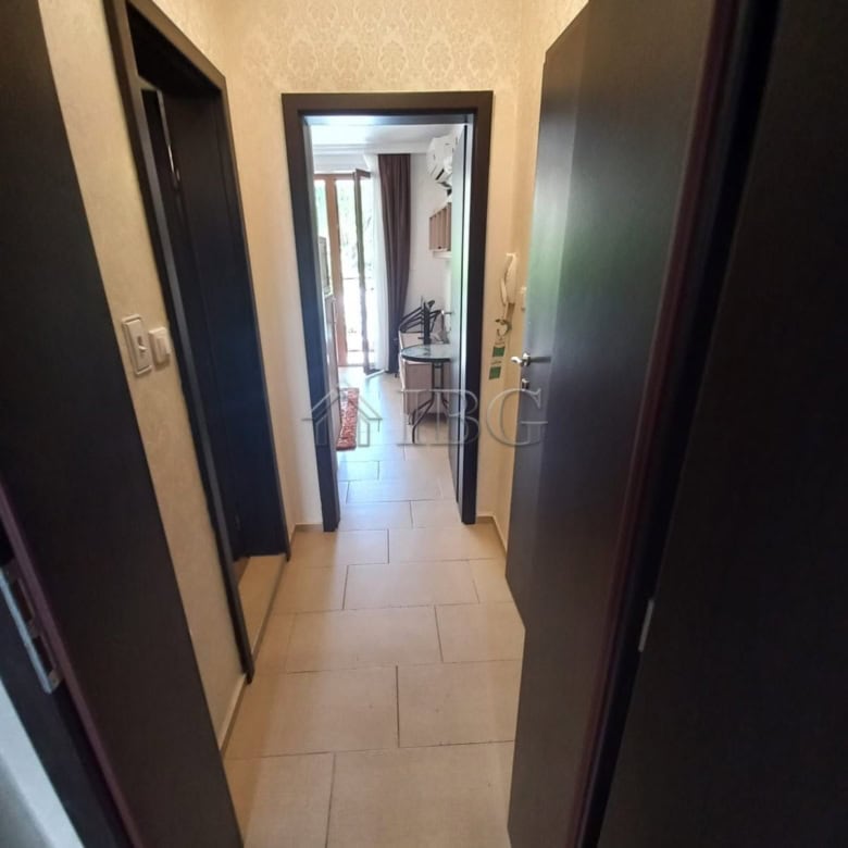 Bright, inviting corridor with neutral tones and natural light.