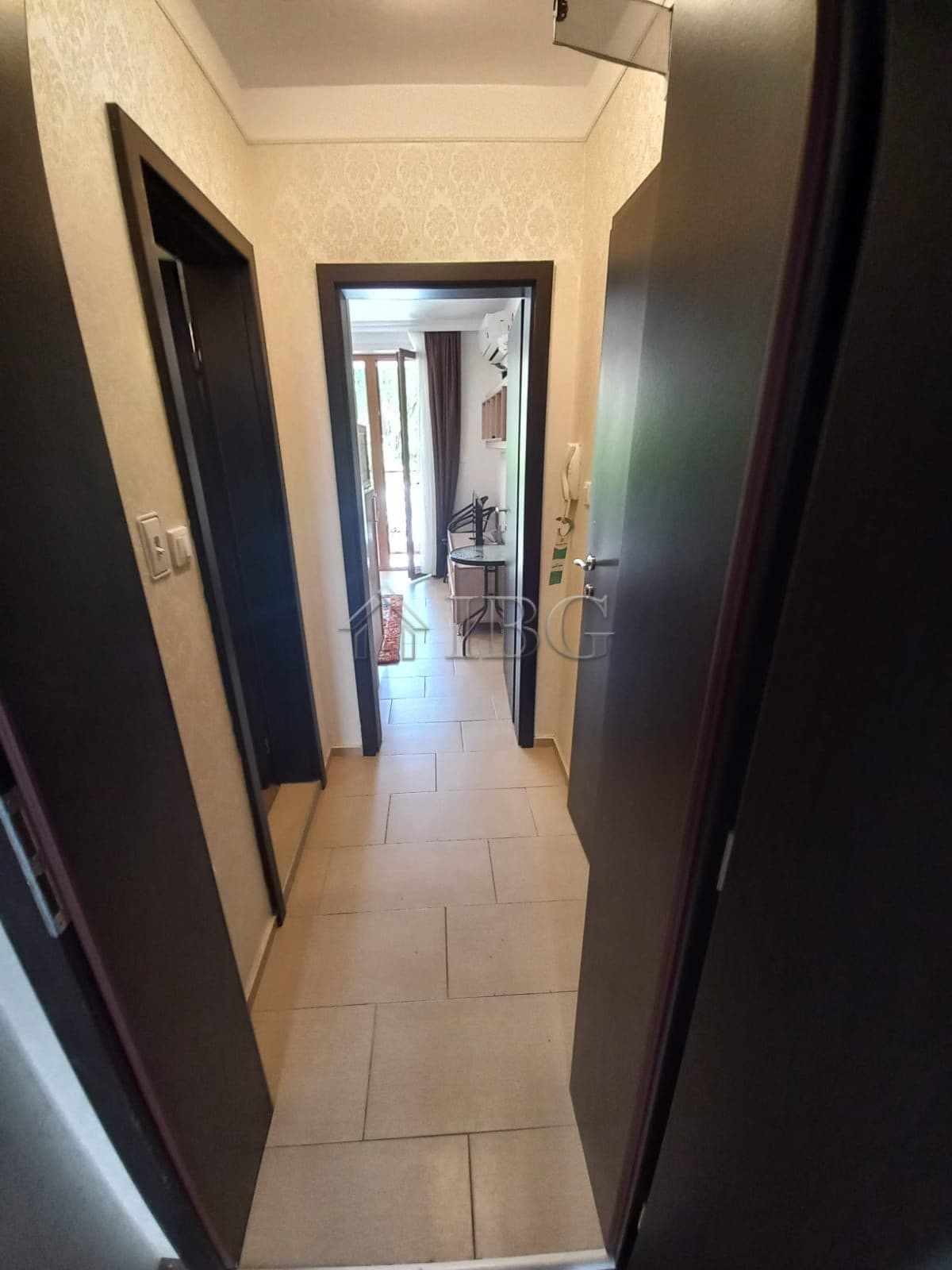 Bright, inviting corridor with neutral tones and natural light.