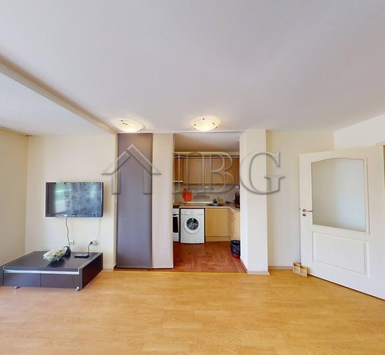 Spacious 2-bedroom apartment in Sunny Fort complex, Sunny Beach, with open-plan living area and mode.