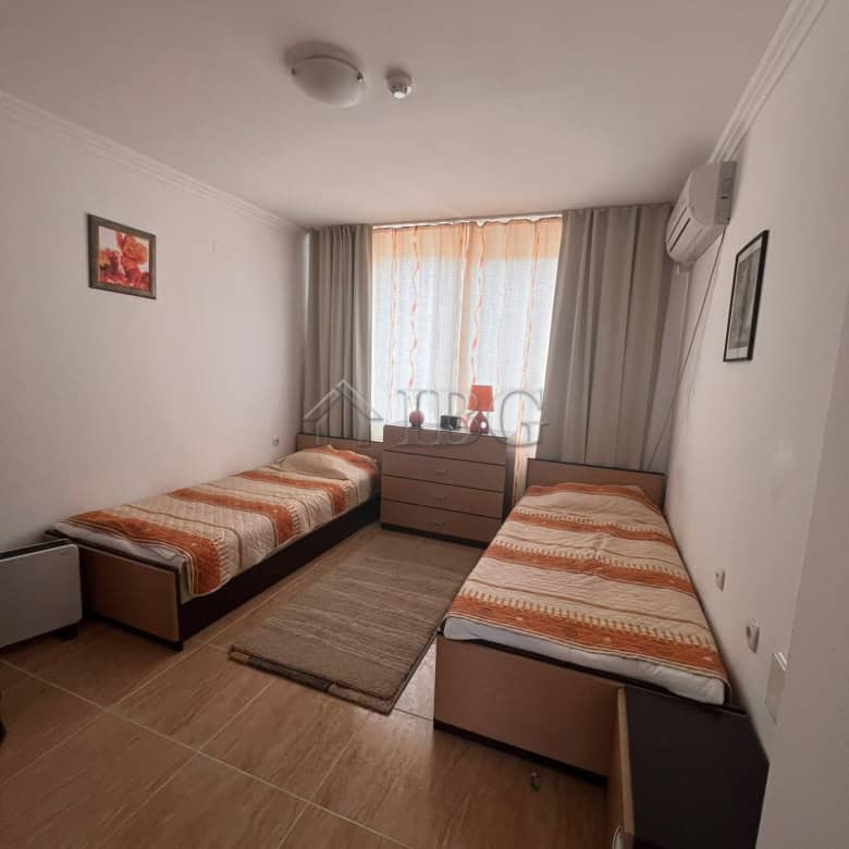 Two-bedroom apartment in Sveti Vlas with sea and pool vistas, modern furnishings, and bright natural.