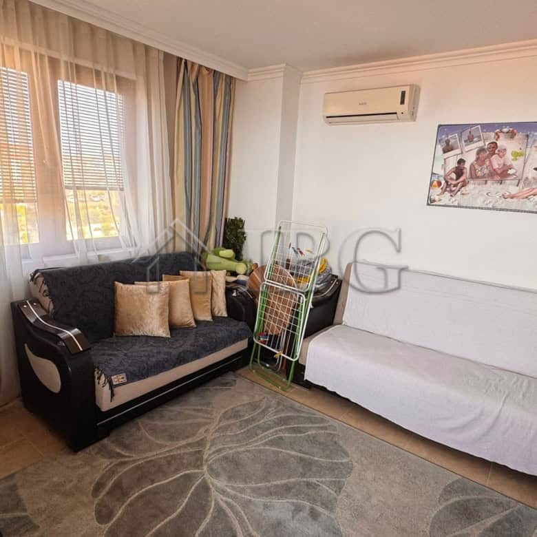 Interior of a two-bedroom apartment with sea view in Sveti Vlas, featuring a living room with sofa a.