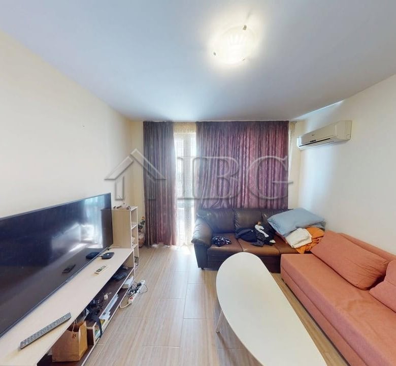 Interior of a 1-bedroom apartment with pool view in Kosharitsa, Bulgaria.