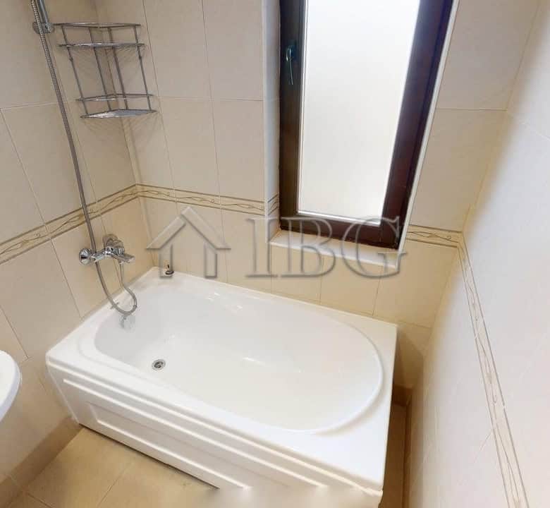 Bright bathroom with bathtub in Bay View Villas complex, Kosharitsa.