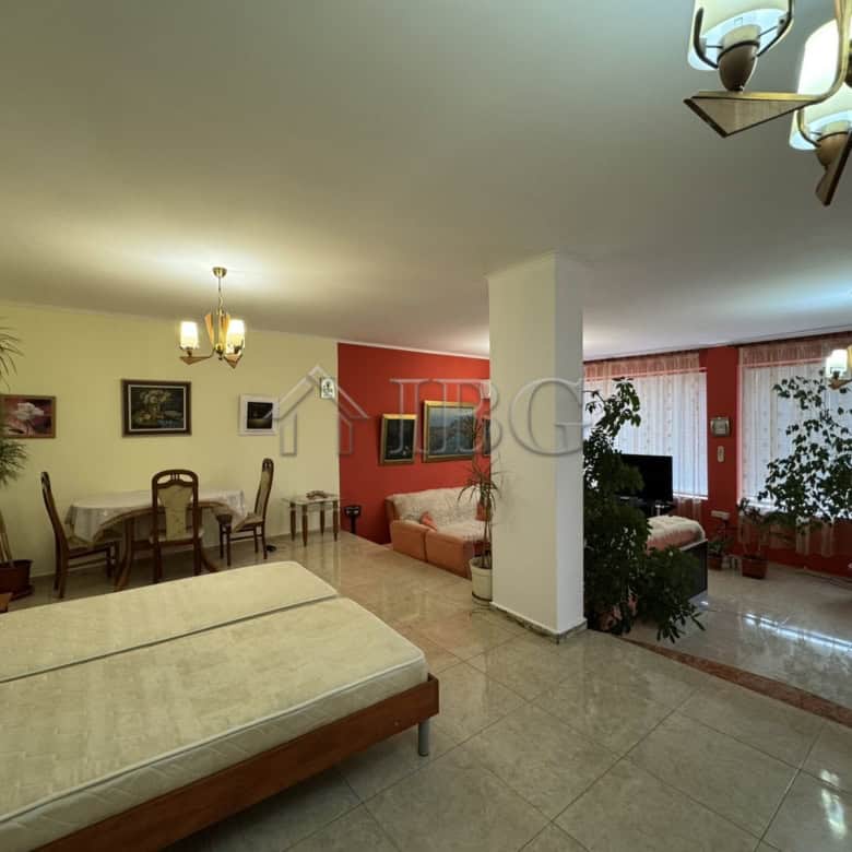 Elegant living room with large windows and abundant natural light in Kosharitsa.