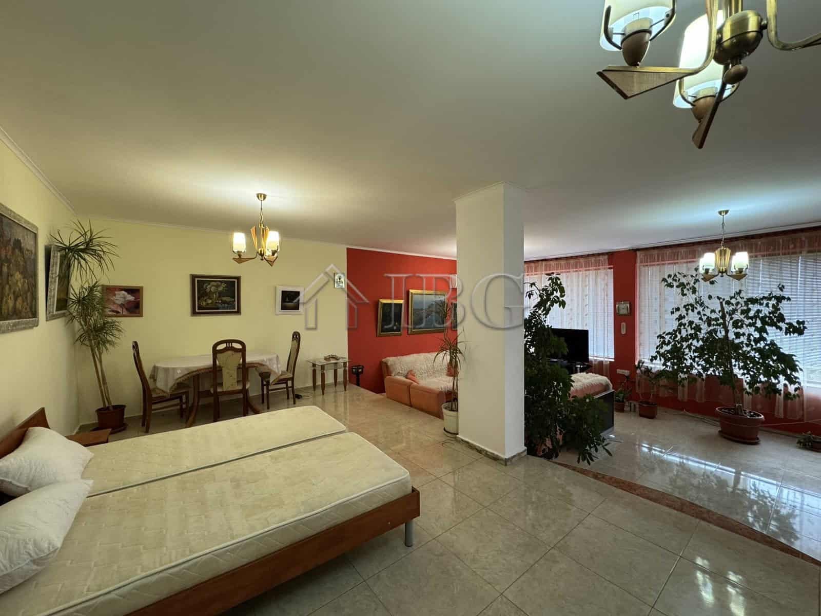 Elegant living room with large windows and abundant natural light in Kosharitsa.