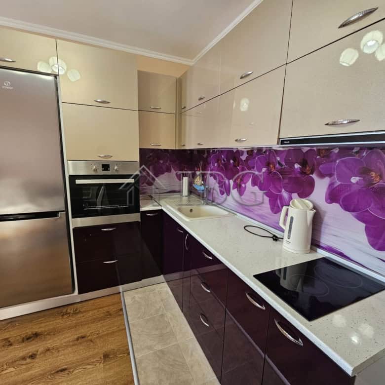 Modern kitchen with purple floral backsplash in Ravda.