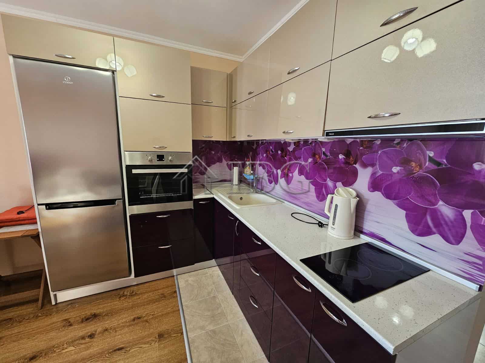 Modern kitchen with purple floral backsplash in Ravda.