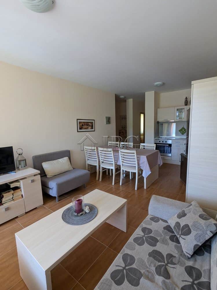 Bright living room in Sveti Vlas apartment with pool view and modern furnishings.