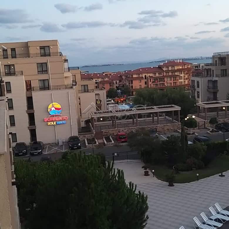Sea and pool view from a one-bedroom apartment in Sveti Vlas, Luxor, showcasing modern buildings and.