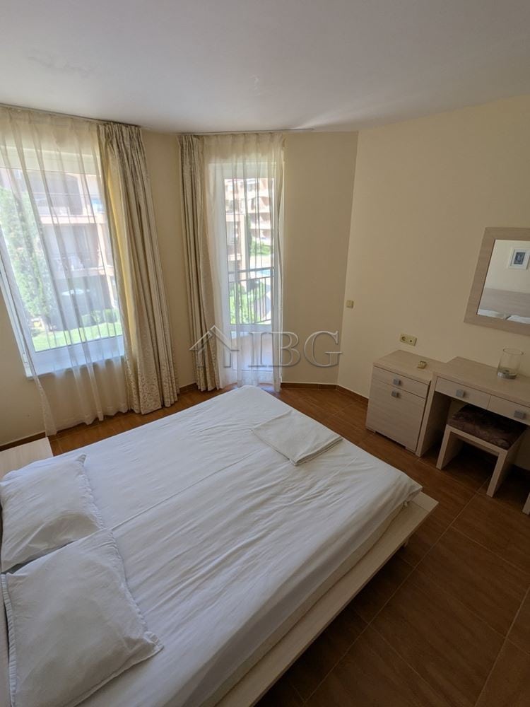 Spacious bedroom with large windows offering a pool view in Panorama Dreams, Sveti Vlas. Perfect for.