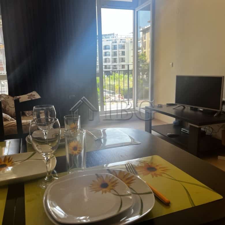 Bright living room with large balcony overlooking pool in Sunset Beach 3, Sunny Beach.
