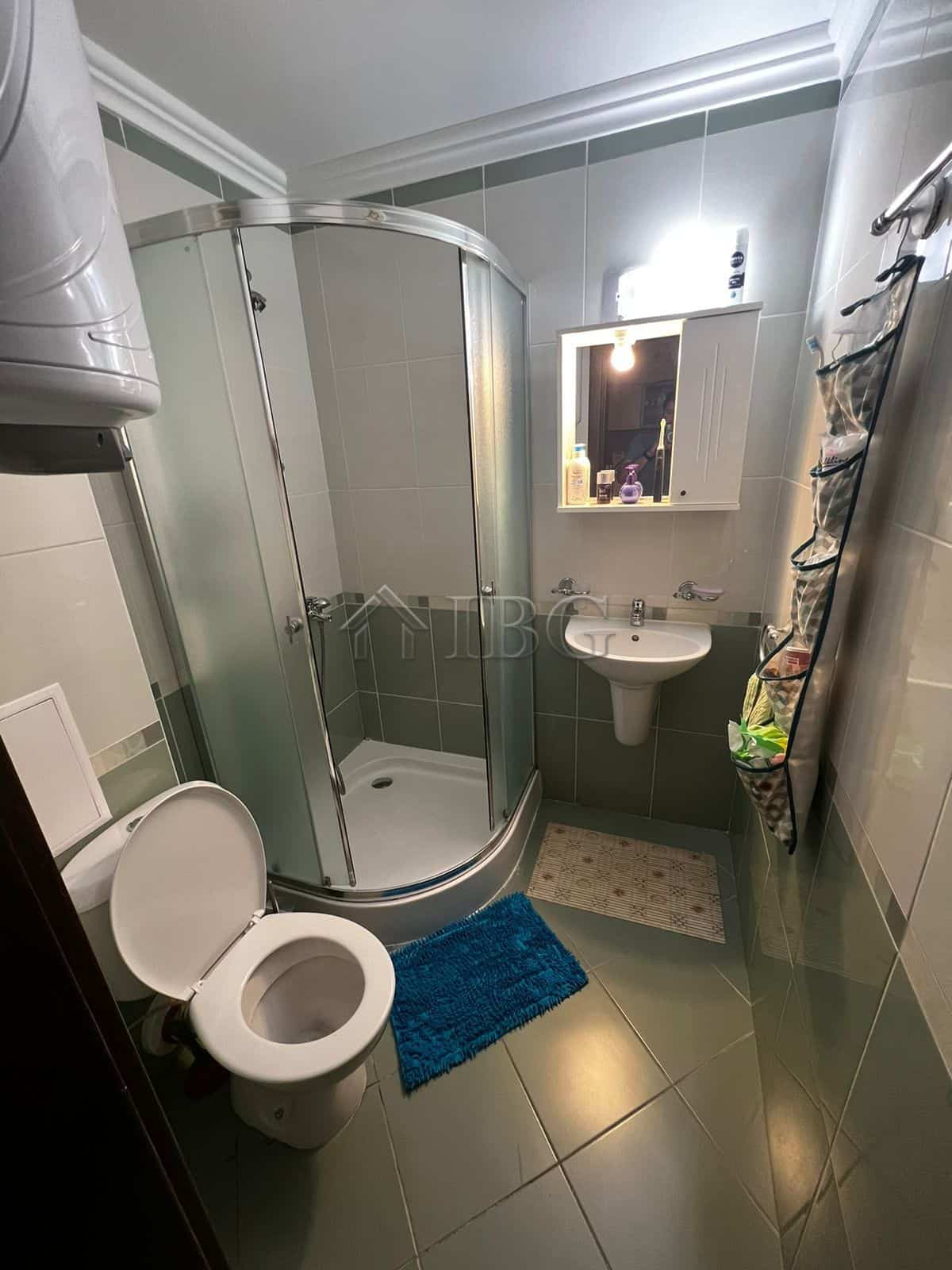 Bright bathroom with shower, sink, and toilet in Kambani 3 complex, Sveti Vlas.