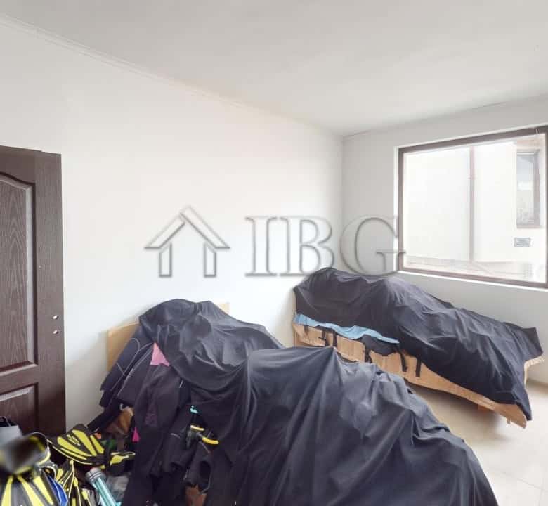 Bright interior of a 2-bedroom apartment with large windows and balcony views in Kosharitsa.