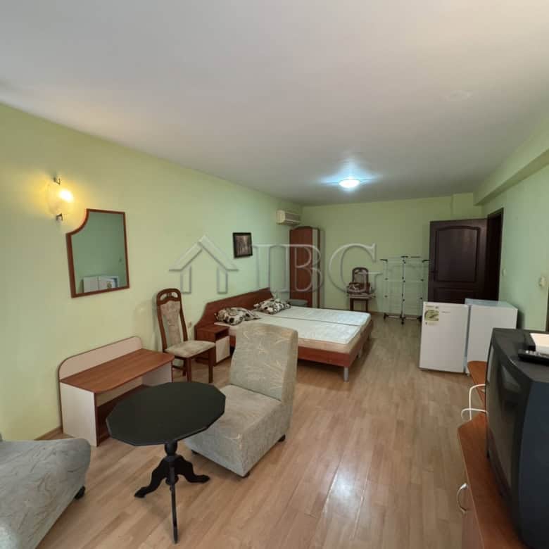 Interior view of a spacious, furnished four-story house in Kosharitsa with living area and bedroom.