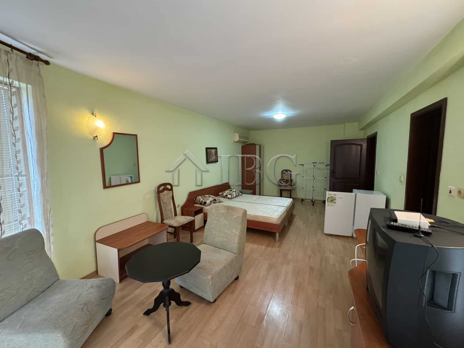 Interior view of a spacious, furnished four-story house in Kosharitsa with living area and bedroom.