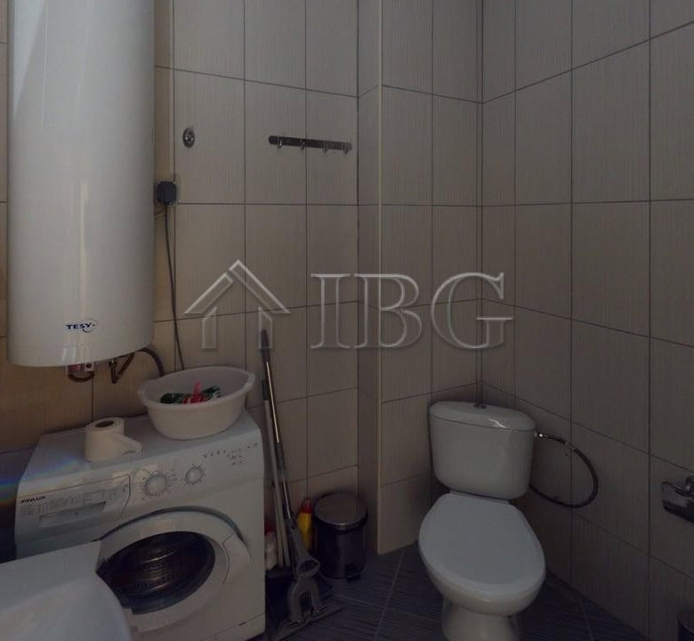 Bathroom with washing machine, toilet, and shower in Avalon Complex, Sunny Beach.