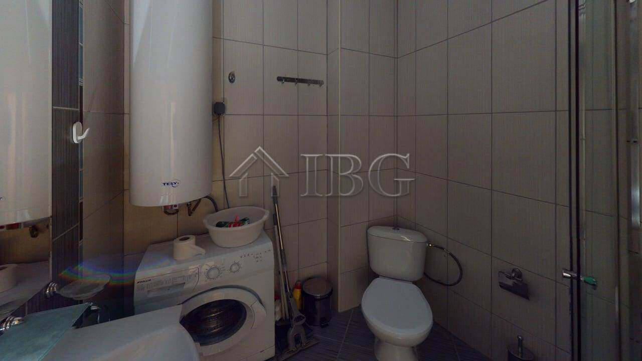 Bathroom with washing machine, toilet, and shower in Avalon Complex, Sunny Beach.