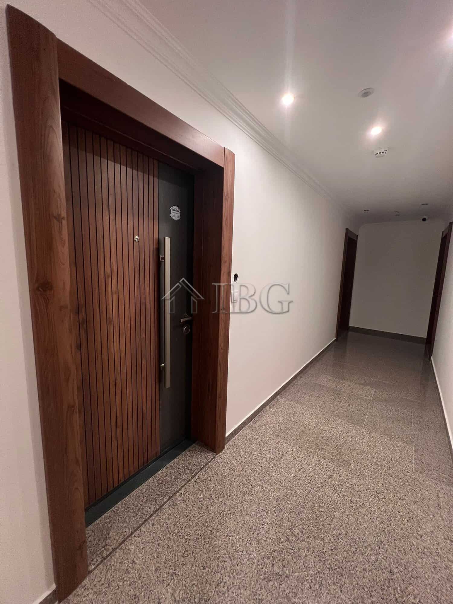 Entrance door of a modern one-bedroom apartment in Sveti Vlas, Bulgaria.