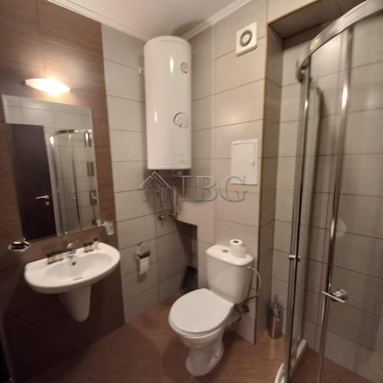 Bathroom with shower, toilet, and sink in Harmony Suites 1, Sunny Beach.