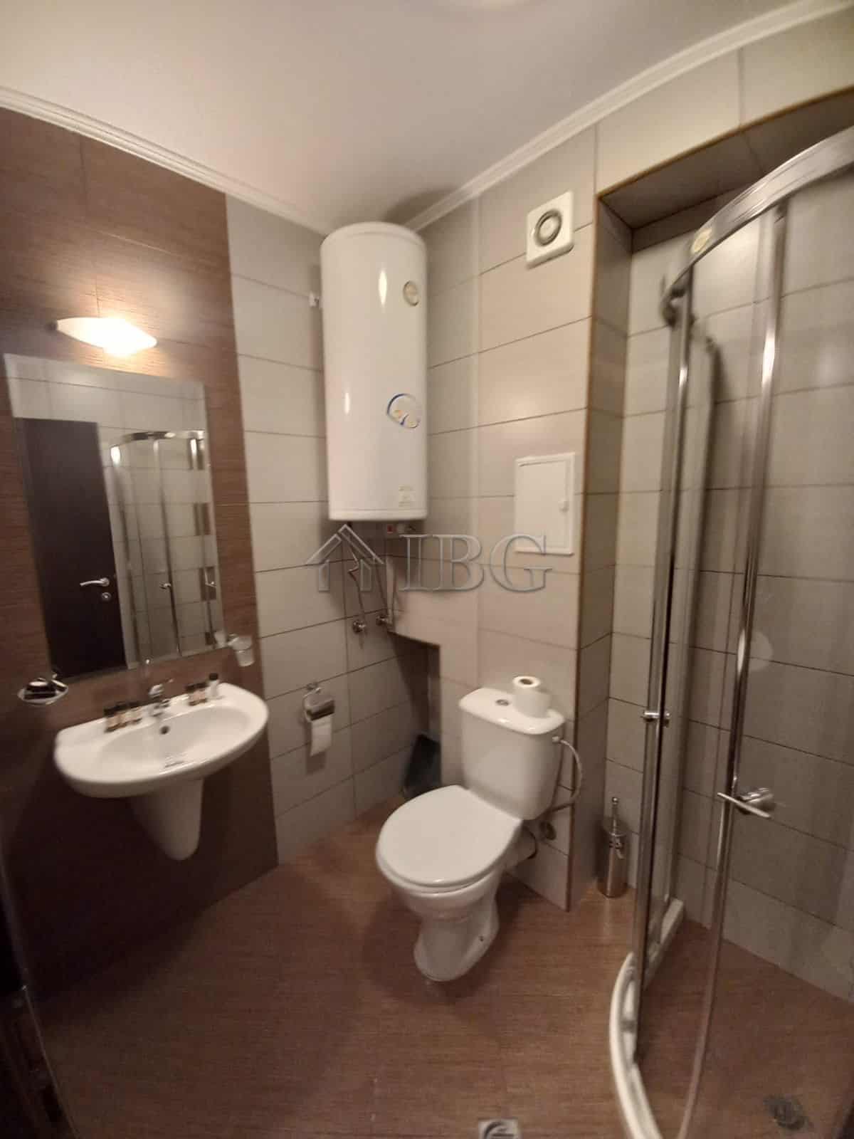 Bathroom with shower, toilet, and sink in Harmony Suites 1, Sunny Beach.