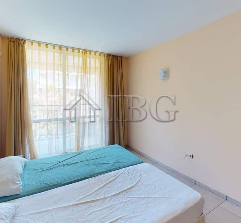 Bedroom with large window and natural light in Avalon Complex, Sunny Beach.