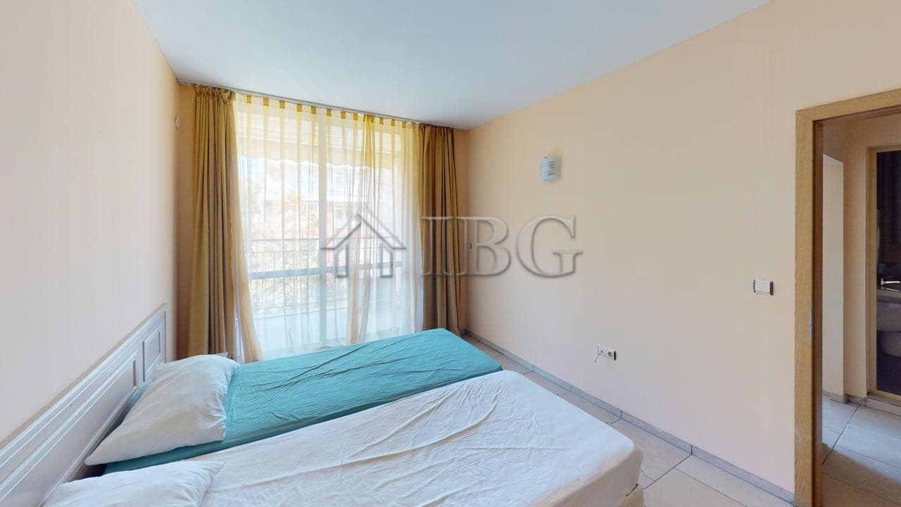 Bedroom with large window and natural light in Avalon Complex, Sunny Beach.