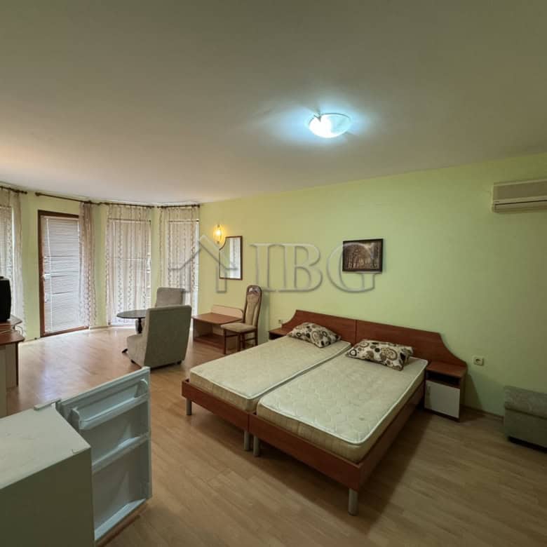 Bright living room with large windows and balcony access in Kosharitsa.