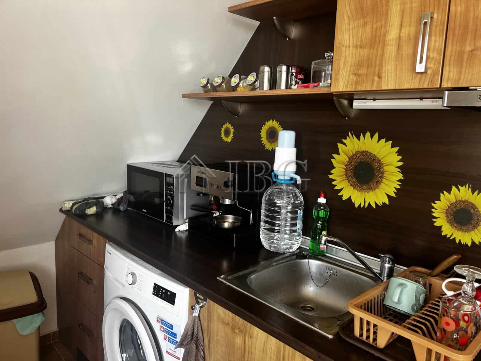 Interior of a small kitchen in a 1-bedroom apartment with sea view in Ravda, Bulgaria.
