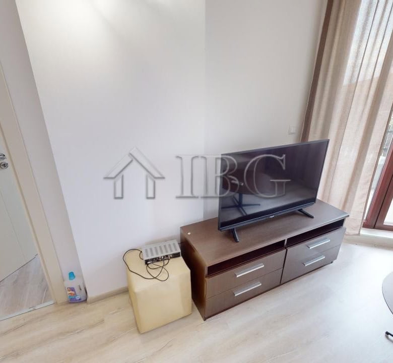 Bright living room with TV and balcony in Bay View Villas, Kosharitsa.