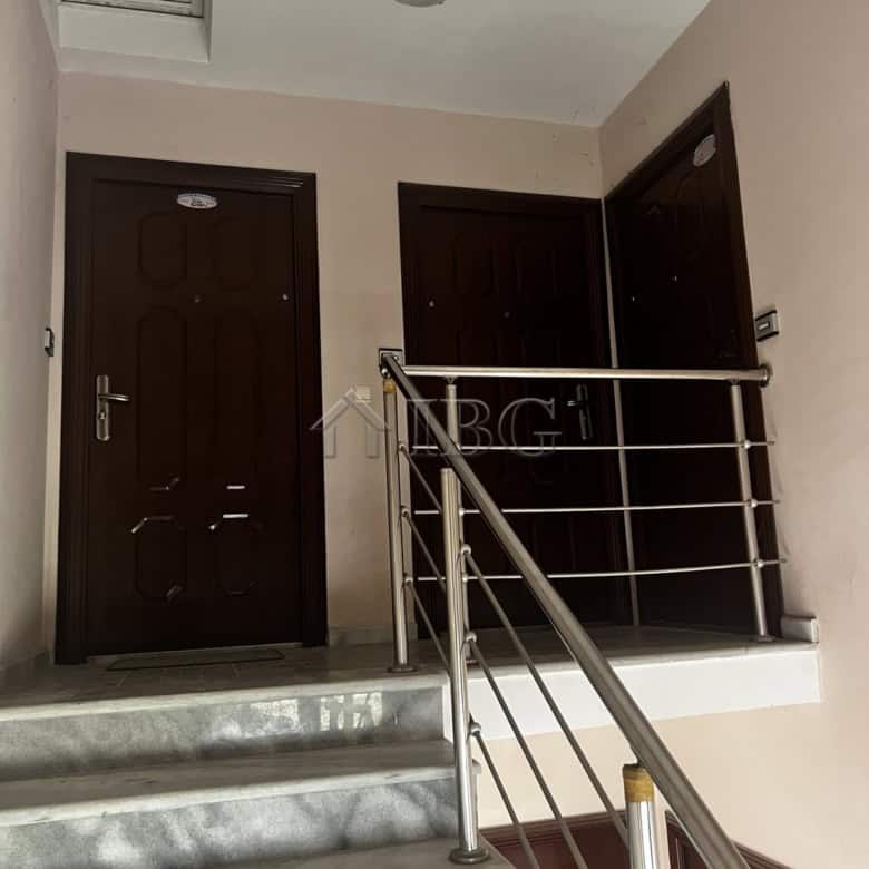 Interior view of a modern apartment with staircase and doors in Ravda, Bulgaria.
