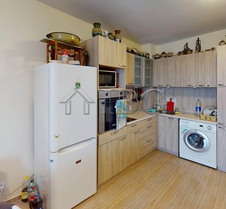 Modern kitchen with appliances in Kosharitsa apartment near Rio complex.