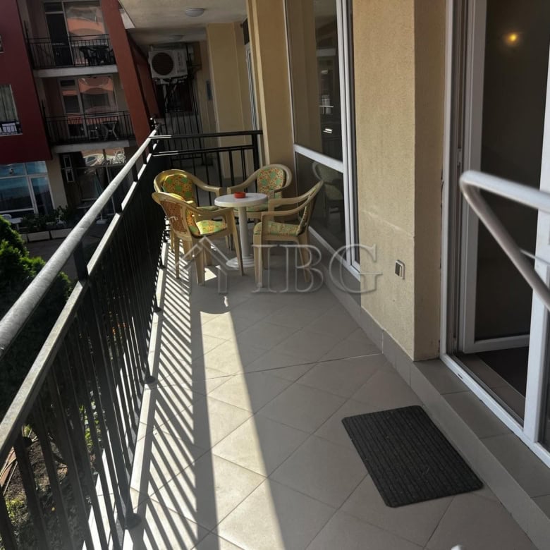 Balcony overlooking pool area at Sunset Beach 3, Sunny Beach, with outdoor seating.