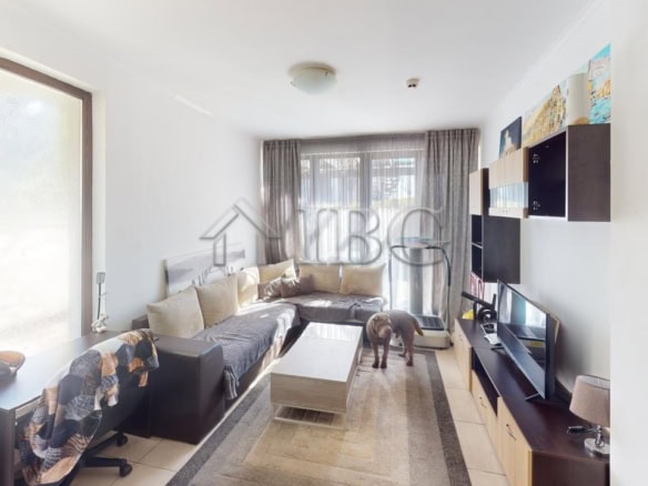 Bright living room with large windows and modern furnishings in Bay View Villas, Kosharitsa.