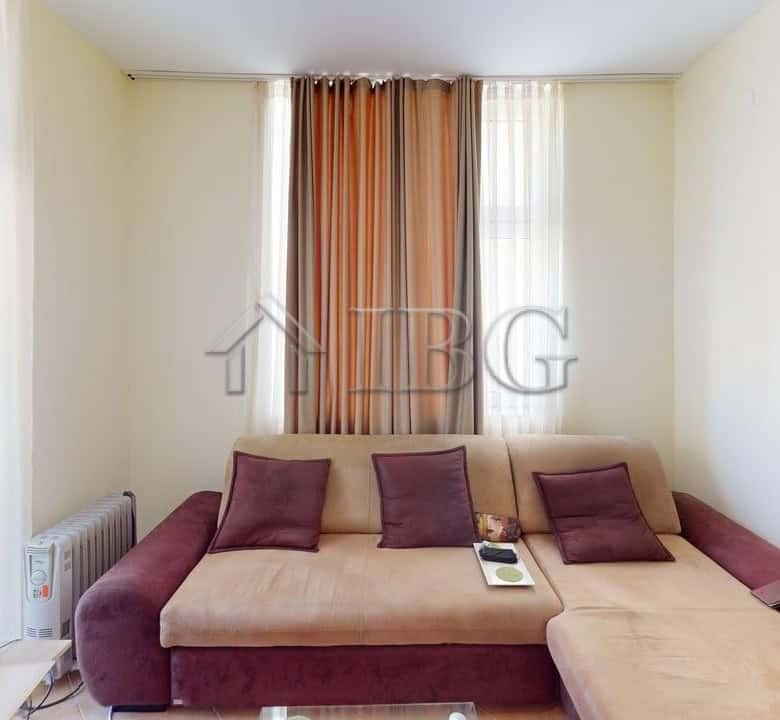 Bright living room with sofa, cushions, and curtains in Barco Del Sol, Sunny Beach.