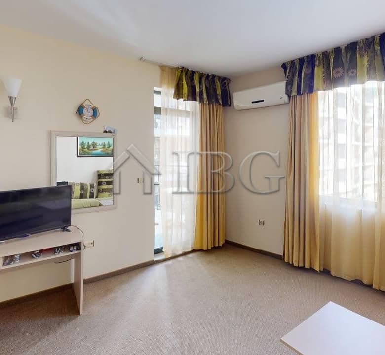 Bright living room with large windows and sea views in Sunny Beach Avalon complex.
