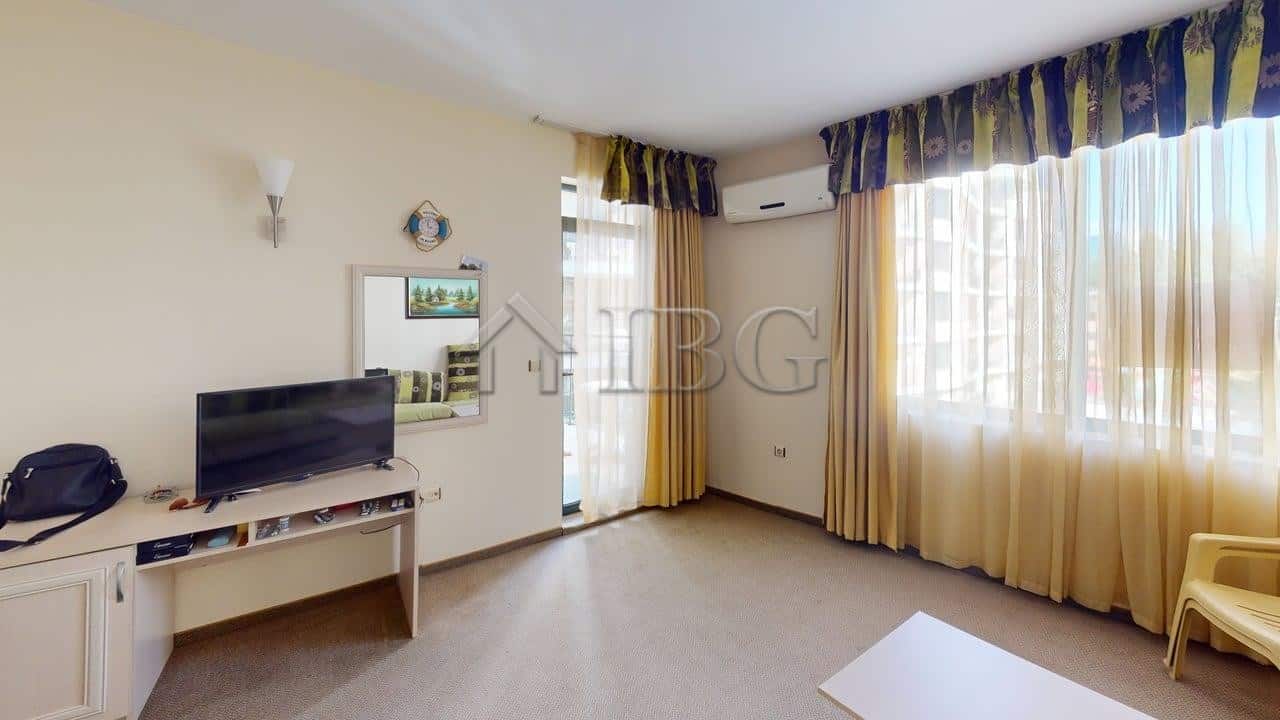 Bright living room with large windows and sea views in Sunny Beach Avalon complex.