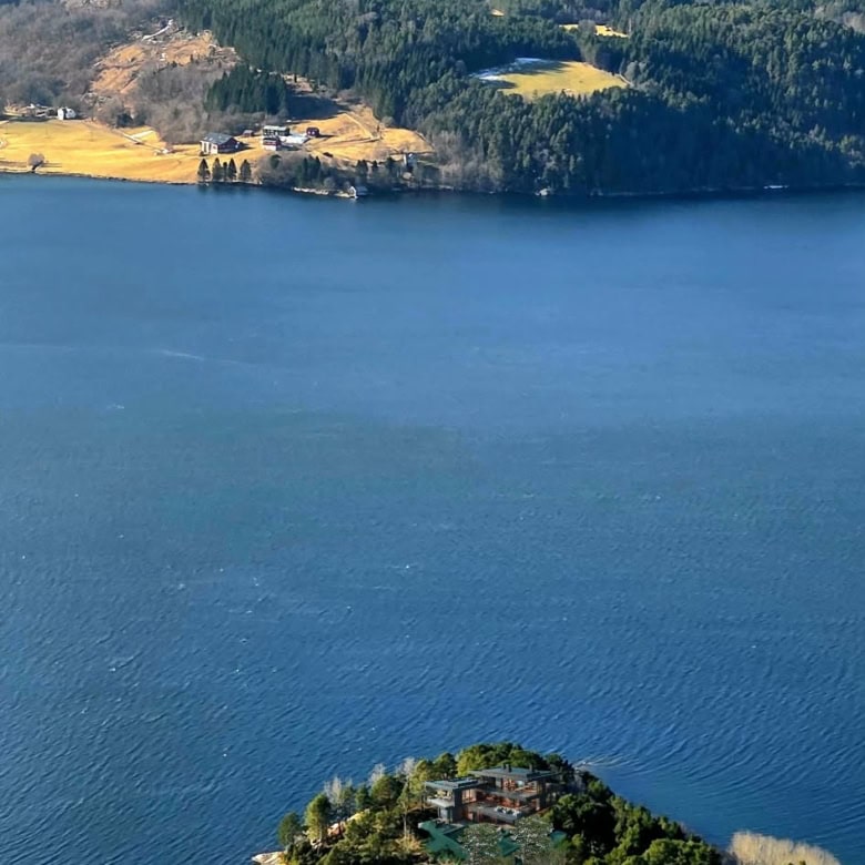 Waterfront property on a private peninsula in Norway with stunning mountain views.