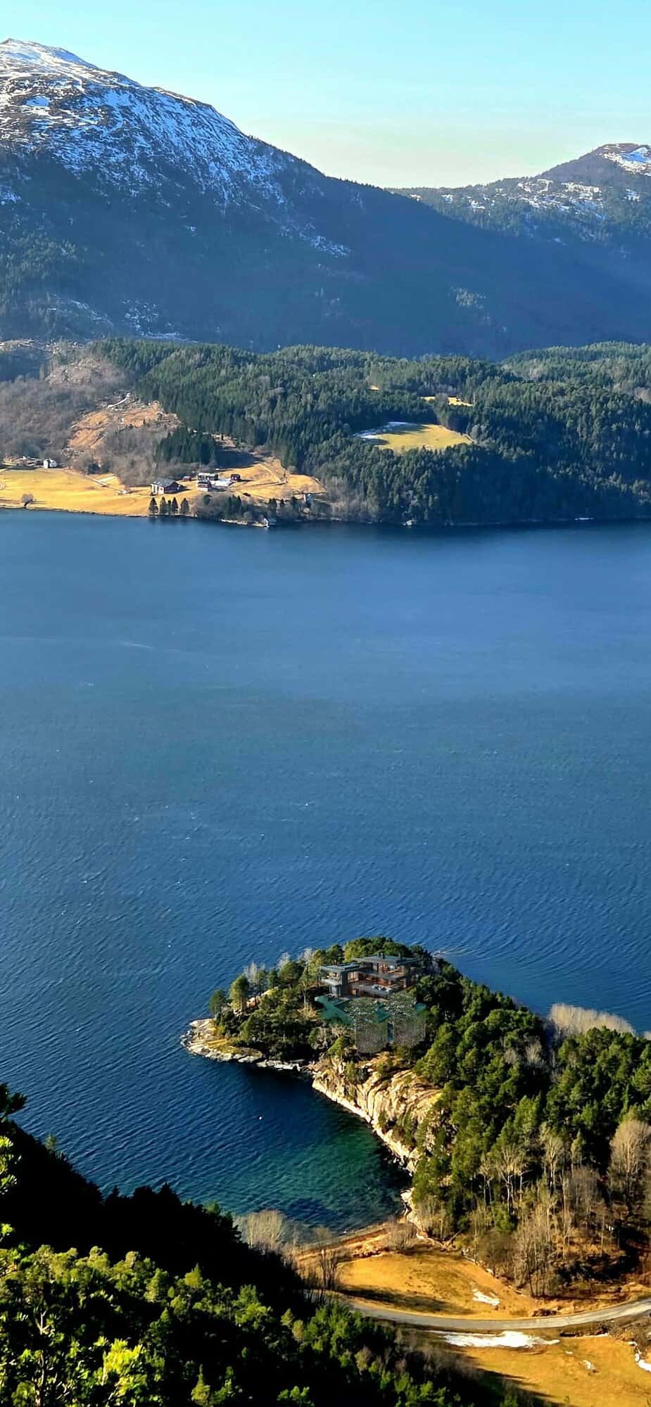 Waterfront property on a private peninsula in Norway with stunning mountain views.