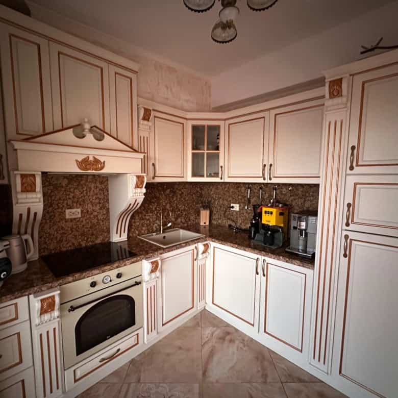Apartment kitchen with modern appliances and elegant cabinetry in Venera Palace, Sunny Beach.