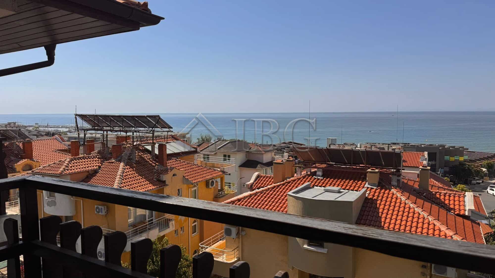 Balcony view of rooftops and sea in Sveti Vlas, Bulgaria.